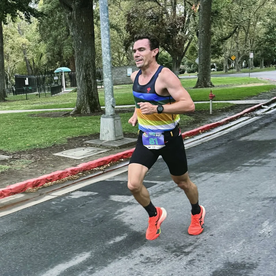 Brandon Costa running in a road race.